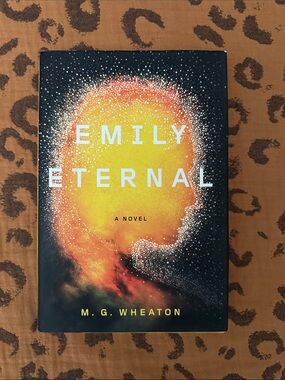 Emily Eternal by M. G. Wheaton — Black & Yellow Hardcover Novel